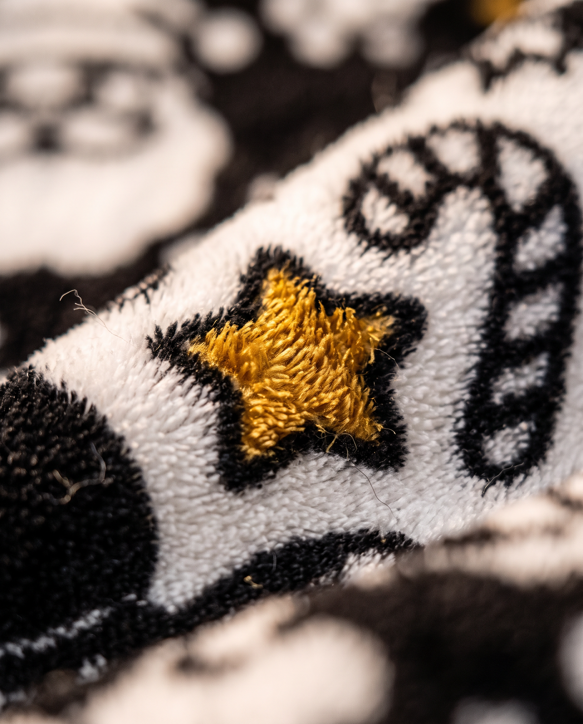 Macro of soft velvet fleece with a star colored in gold