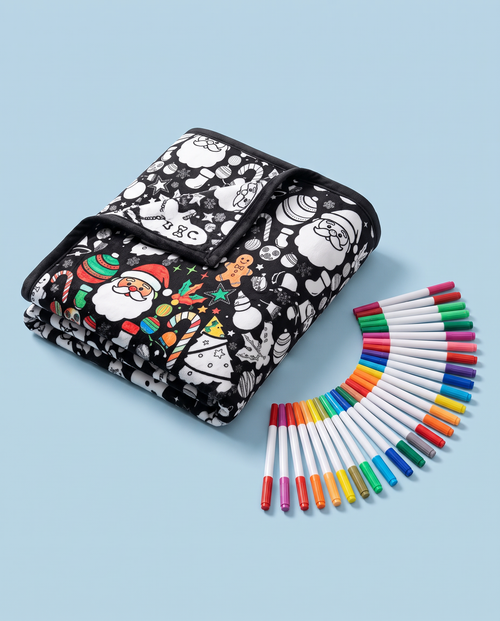 Folded Christmas coloring blanket with 24 markers on a powder-blue background
