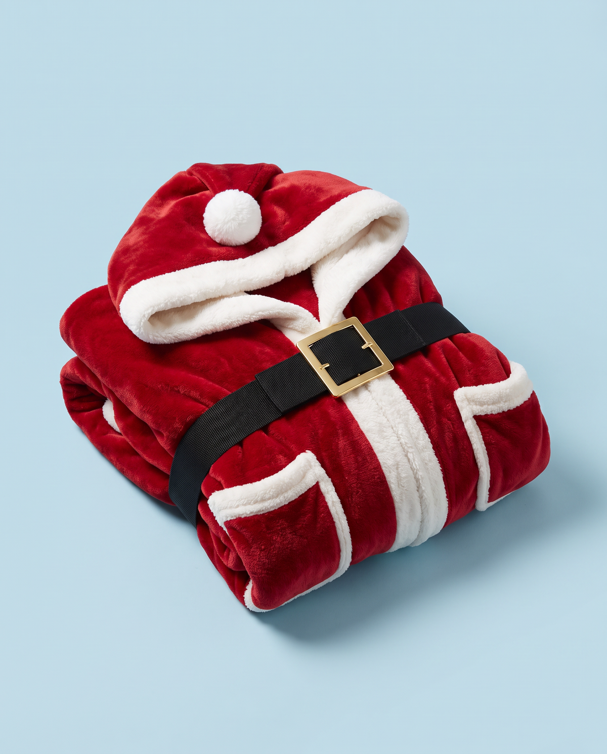 The Santa robe folded on a powder-blue background