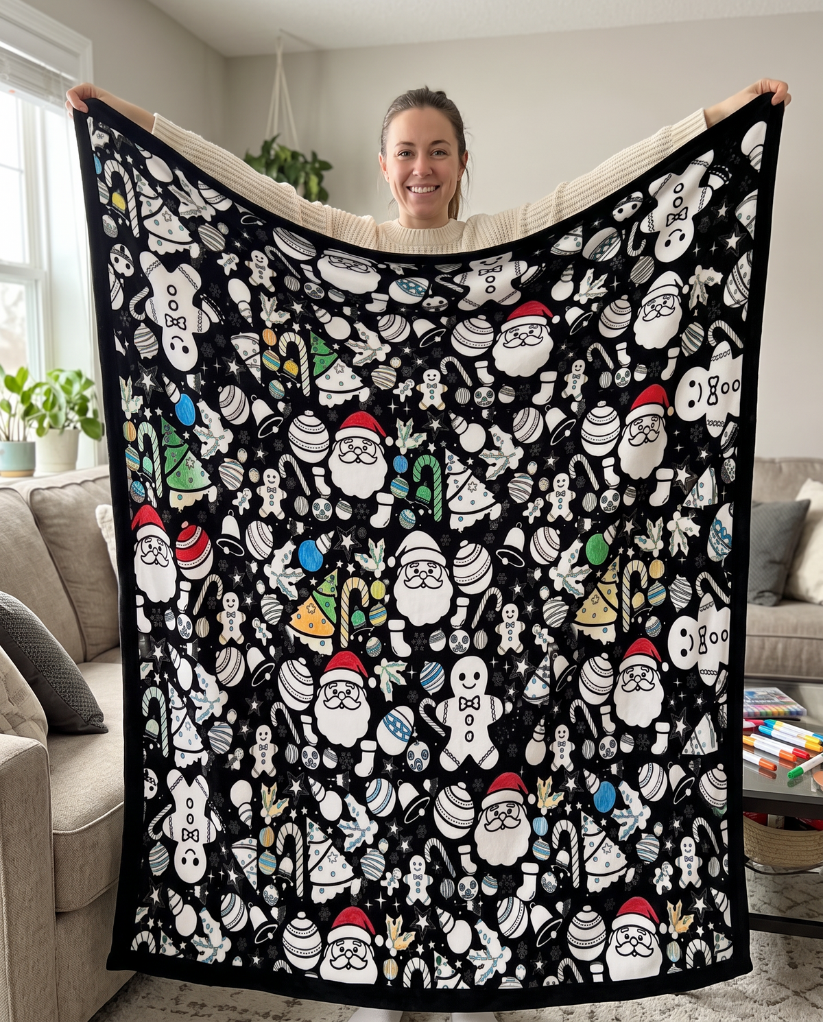 Woman holding the coloring blanket open to show its 59 x 49 inch size