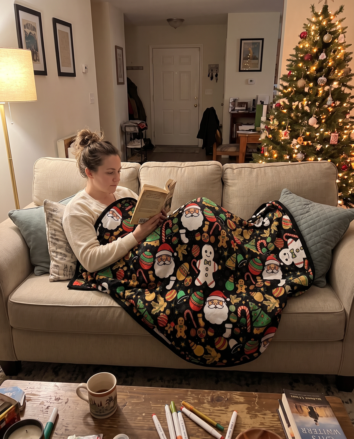 Woman snuggled on the sofa under her finished coloring blanket